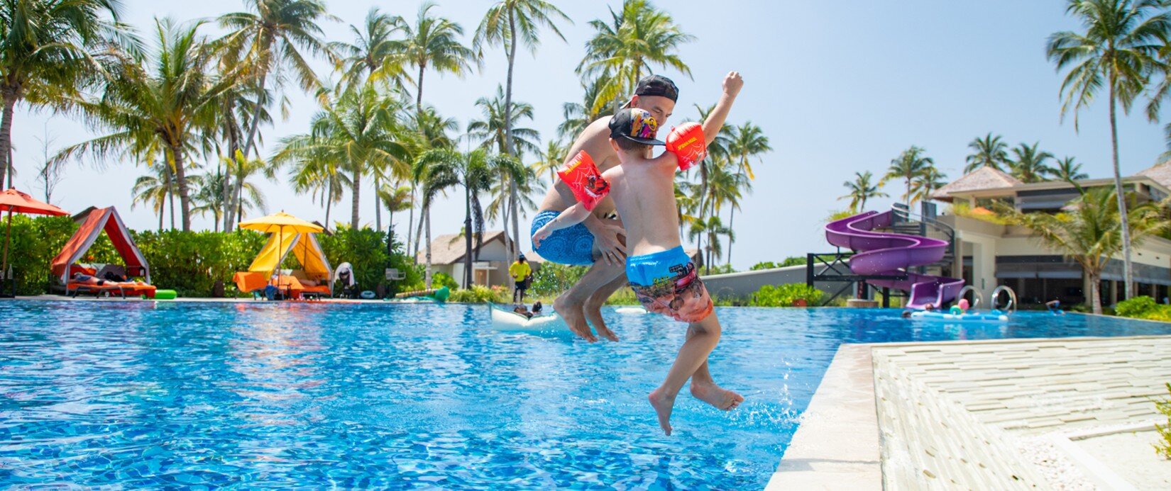 A Farther enjoying with his son  in a pool at Hardrock Maldives